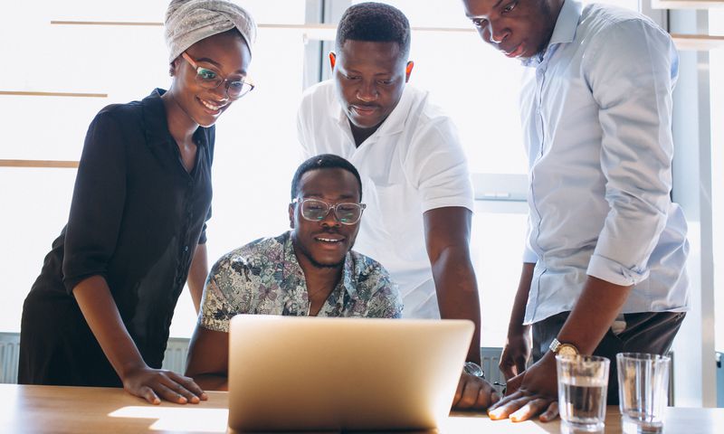 A group of staff working together in an office
