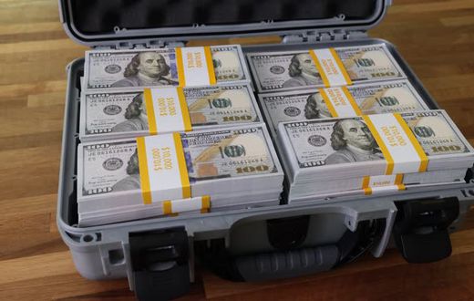 A briefcase with dollars