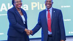 Dir. Patrick Tumbo- Group CEO Sanlam Kenya PLC shake hands with Jacqueline Karasha, CEO Sanlam Life during the launch of Akiba Plus, a tech driven pension solution for flexible retirement planning.