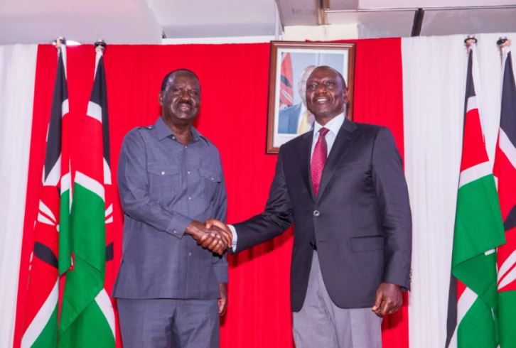 Former Prime Minister Raila Odinga shakes hands with President William Ruto after the two signed a cooperation agreement at KICC on March 7, 2025