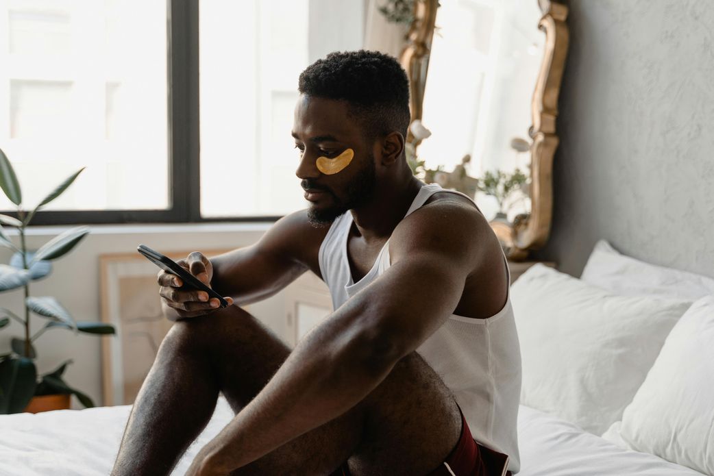 A man sitting on the bed