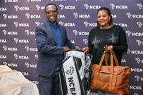 NCBA Group MD John Gachora awards Zipporah Gichigi, the Overall Lady Gross Winner at the Sigona Golf Club leg of the NCBA Golf Series