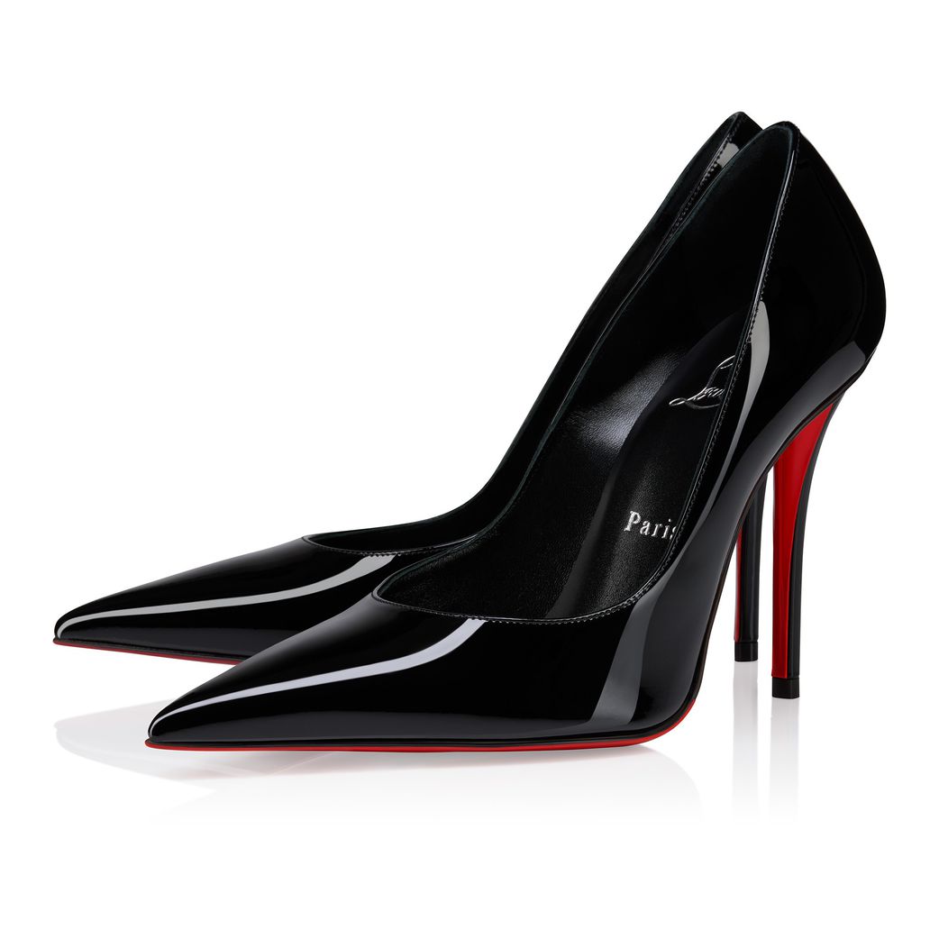 A pair of red-soled, high-heeled Louboutin shoes