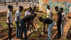 An AI-generated image of young people planting trees