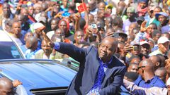 Former Interior Cabinet Secretary Fred Matiang’í acknowledges greetings from his supporters in Kisii town on May 2
