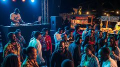 An AI-generated photo of people enjoying music in an event