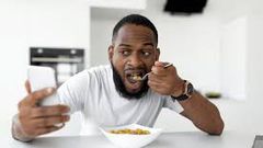 A man having cereal for breakfast