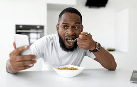 A man having cereal for breakfast