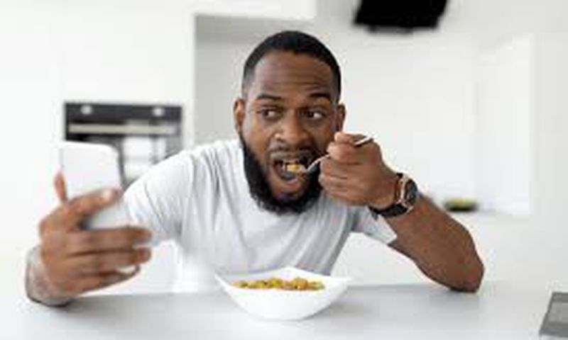 A man having cereal for breakfast