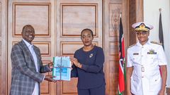 President William Ruto receives a report on the helicopter crash that killed General Francis Ogolla from Defence Cabinet Secretary Soipan Tuya at State House, Nairobi.