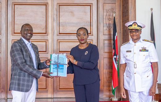 President William Ruto receives a report on the helicopter crash that killed General Francis Ogolla from Defence Cabinet Secretary Soipan Tuya at State House, Nairobi.