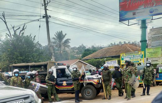 Police armed with clubs, some in anti-riot gear at Boniface Kariuki's burial