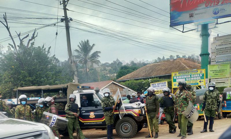 Police armed with clubs, some in anti-riot gear at Boniface Kariuki's burial