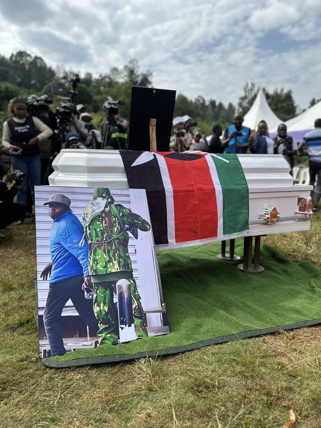 The casket with Boniface Mwangi's body at his burial