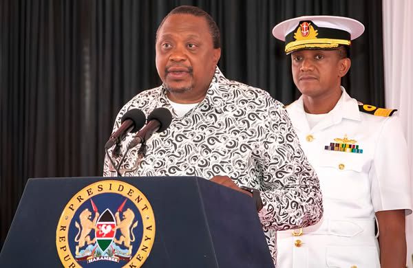 File image of former President Uhuru Kenyatta and his former Aide-de-Camp Major General Timothy Stelu Lekolool at State House Nairobi