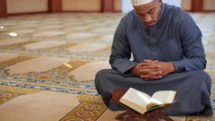A muslim man prayin the mosque