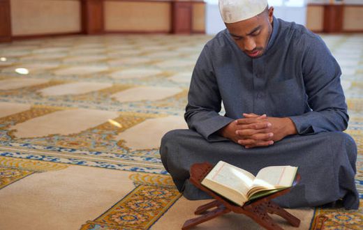 A muslim man prayin the mosque