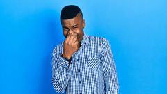 A man feeling bad breathe