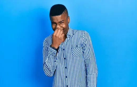 A man feeling bad breathe
