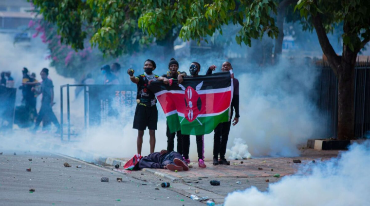 File image of Kenyan protesters hold a Kenyan flag over the body of a fellow youth killed during peaceful protests in Nairobi, Kenya, on 25th June 2024.