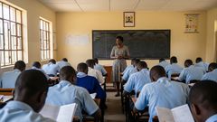 An AI-generated image of a teacher invigilating exams in a class in kenya