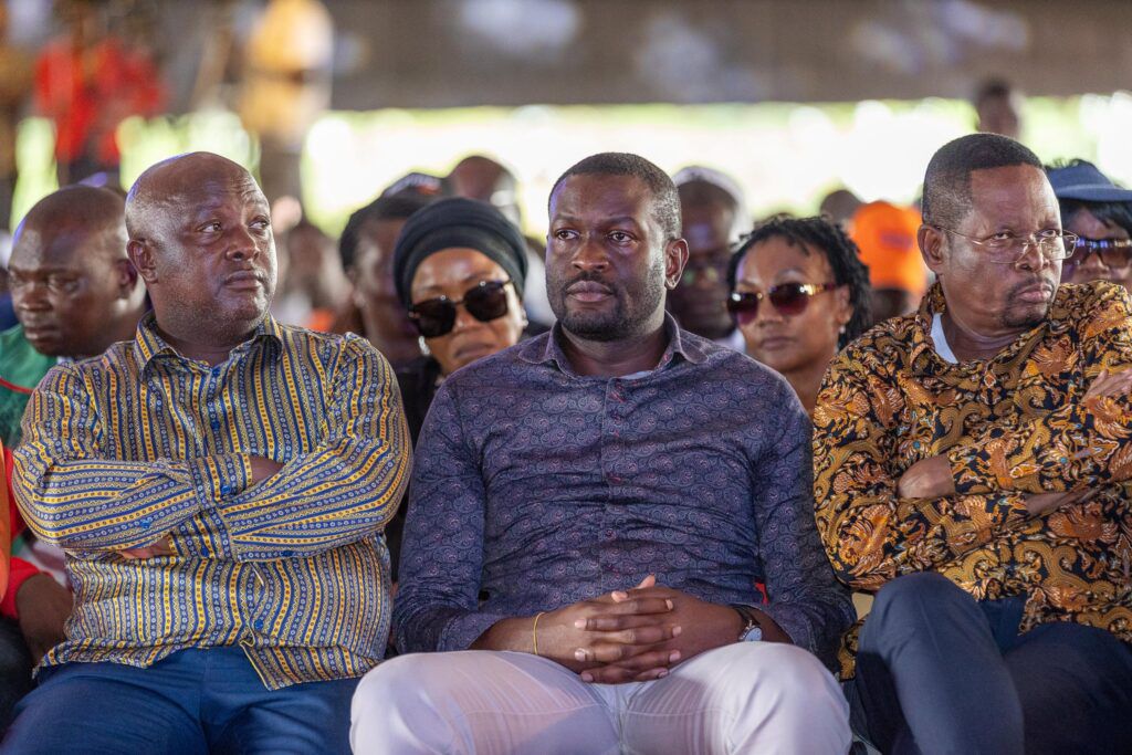 Edwin Sifuna (centre) flanked by other leaders at the funeral of the former PM's bodyguard George Oduor in Ndori, Siaya