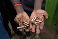 A person holding bullet cartridges