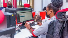 A KRA staff member working on a computer