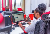 A KRA staff member working on a computer