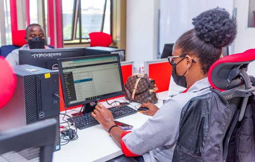 A KRA staff member working on a computer
