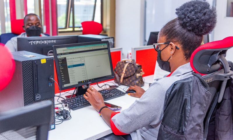A KRA staff member working on a computer