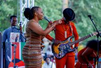 Muthoni wa Kirumba aka Baby Top with Samidoh on stage at the Ngemi Cia Ruraya Cultural Festival in Seattle