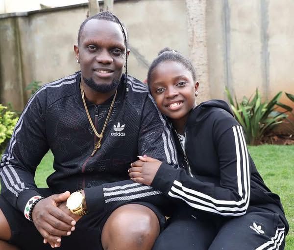 Reggae entertainer Kriss Darlin and his daughter