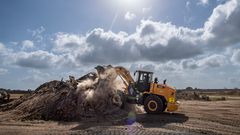 A member of the 475th Civil Engineer Flight at Camp Simba, Manda Bay, Kenya, operates a front loader