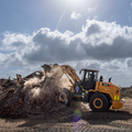 A member of the 475th Civil Engineer Flight at Camp Simba, Manda Bay, Kenya, operates a front loader