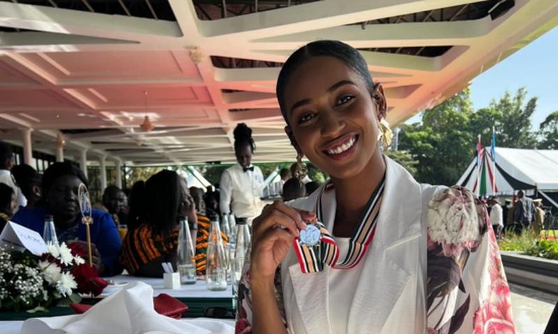 Sarah Hassan shows off her OGW medal awarded by President William Ruto during a luncheon at State House, Nairobi