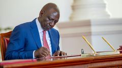 President William Ruto signs a bill into law at State House, Nairobi