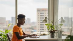 A woman taking a course online