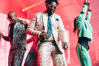 Coster Ojwang performing alongside his bandmates