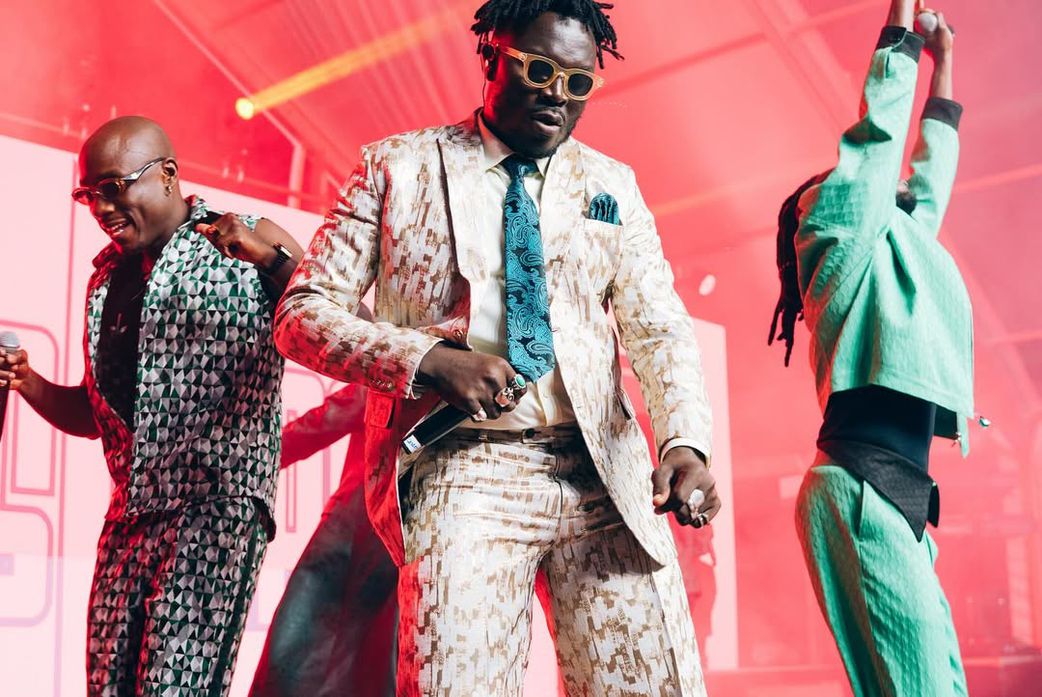 Coster Ojwang performing alongside his bandmates