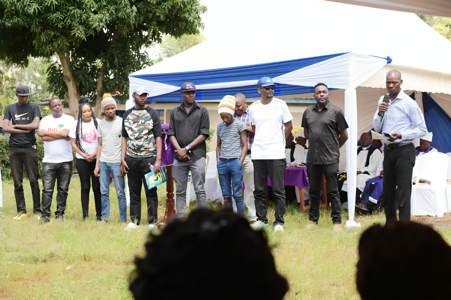 Friends and colleagues during Lion Deh's son's funeral