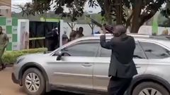A man seen firing a gun in the air during the launch of Rigathi Gachagua's DCP party