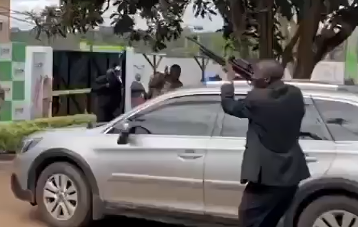 A man seen firing a gun in the air during the launch of Rigathi Gachagua's DCP party