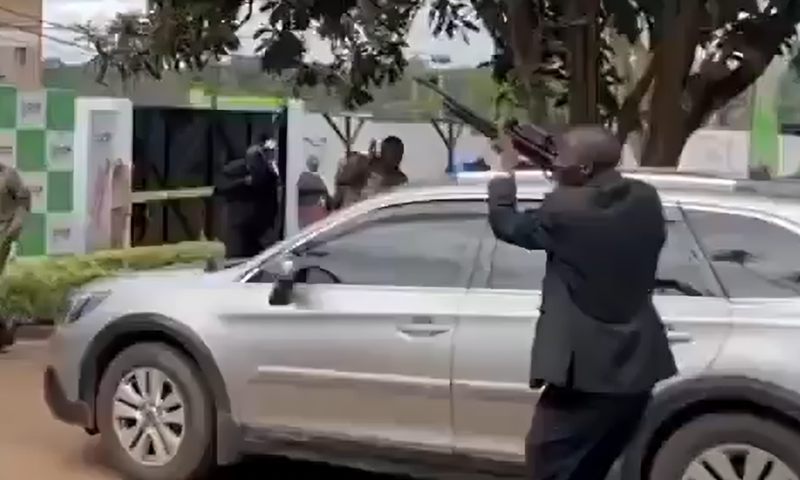 A man seen firing a gun in the air during the launch of Rigathi Gachagua's DCP party