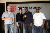 Nyashinski posing after signing a deal with Sony Music