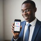 An AI-generated image of a man holding a phone for illustration purposes