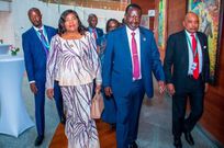 Raila Odinga flanked by his family members and Prof Makau Mutua in Addis Ababa