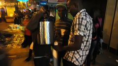 File image of Kenyans enjoying coffee along a street in Nairobi