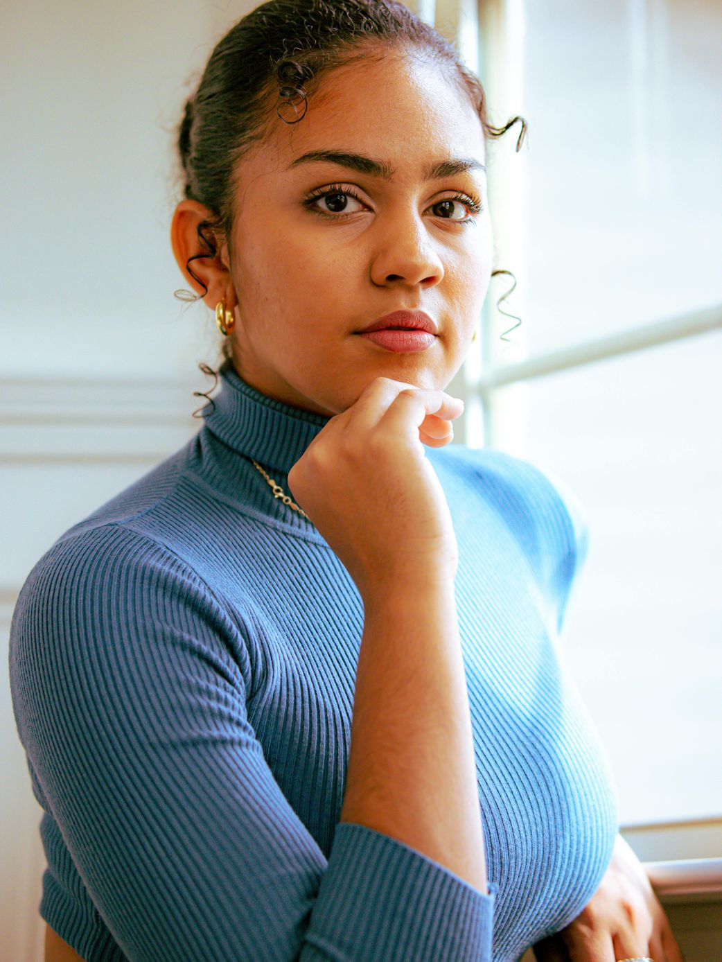A woman wearing a lightweight knit top