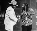 Jemere Morgan on stage with his father, Gramps Morgan